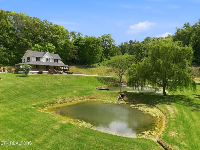 Check out the wrap-around porch!! Almost 8 acres in Tennessee. $1,099,900.