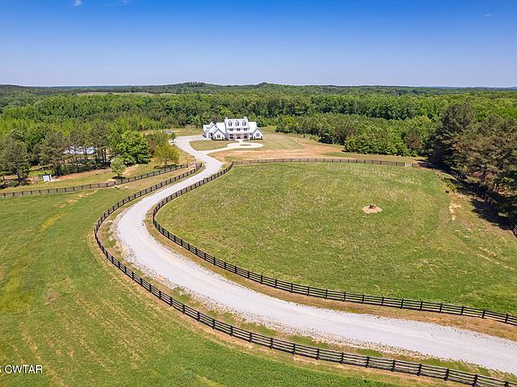 Check out the acreage!! Brand new brick build on 137 acres in TN. $2,100,000.