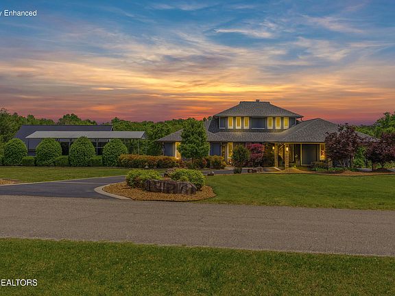 Pristine water views and an incredible pool! Over an acre on the Tennessee River. $1,499,000.