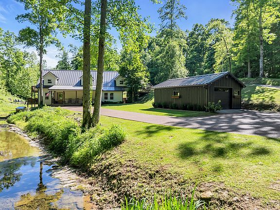 Breathtaking creek-front setting! Over 4 acres in Tennessee. $2,199,000.