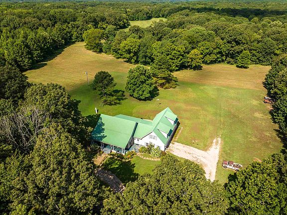Check out those porches! 20 private acres in Tennessee. $469,000.