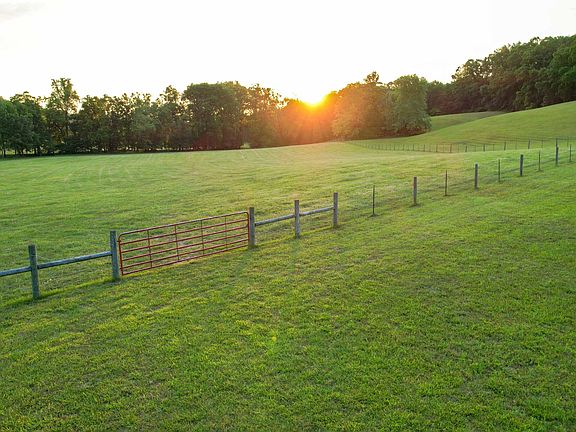 Check out the wrap-around porch! Two homes on 170 acres in Tennessee. $901,300.