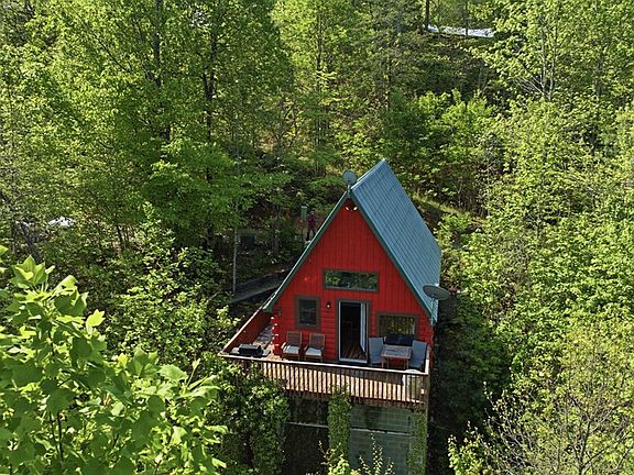 Check out the fireplace! A-frame on a wooded lot in North Carolina. $180,000.