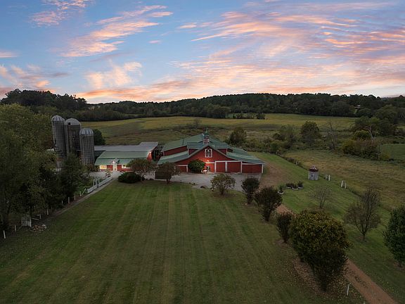 Check out the barns!! 66 rolling acres in Tennessee. $1,200,000.