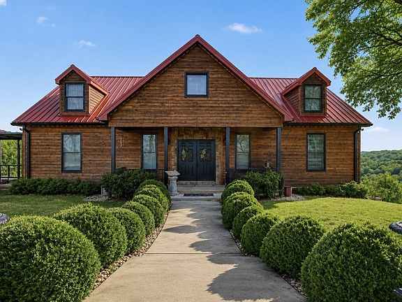 Breathtaking views from every window! Over 6 hilltop acres in Tennessee. $989,000.