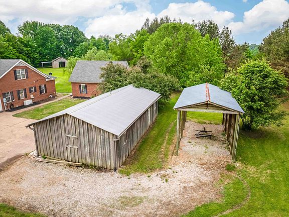 Stocked pond and fruit trees! Over 11 acres in Tennessee. $675,000.