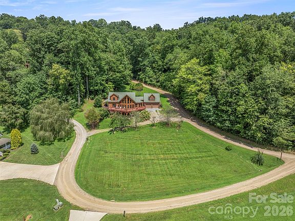 Soaring ceilings and stunning mountain views! 1.1 acres in North Carolina. $960,000.