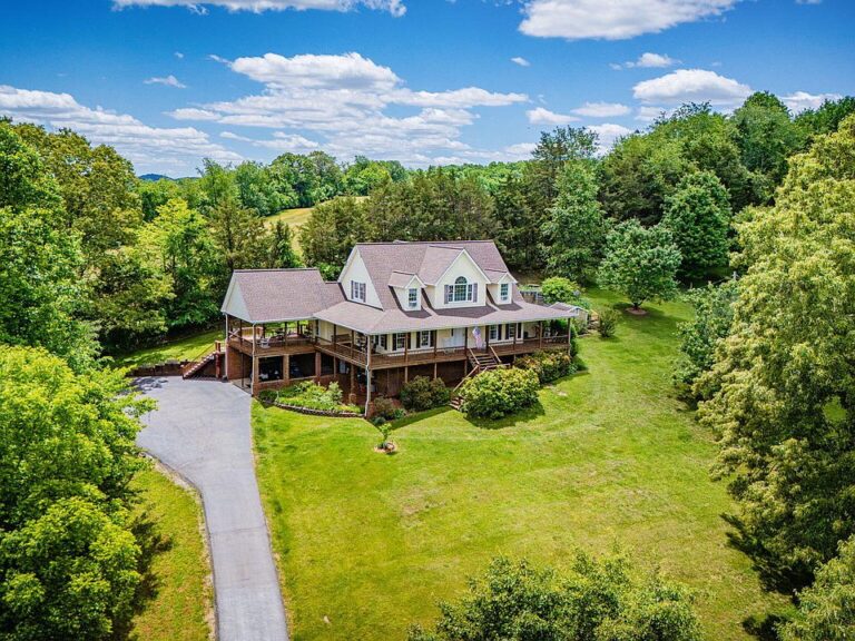 Check out the porch!! Over 10 acres with a creek in Tennessee. $899,900.
