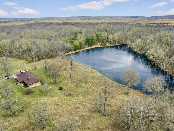 Pretty lake and setting! Nearly 30 acres in Tennessee. $699,999.
