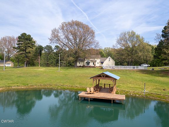 Dreamy lake views and 9 acres! C. 1992 in Tennessee. $679,900.