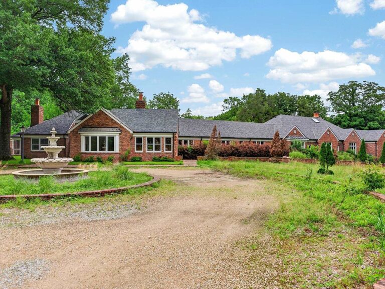 This $1.15M Brick-Gated Estate Has a Hidden Sports Complex & Private Lake!