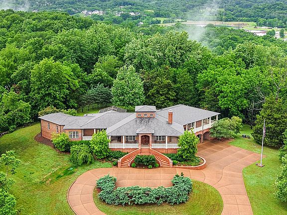 Indoor pool and elevator! Over 5 private acres in Tennessee. $2,899,900.