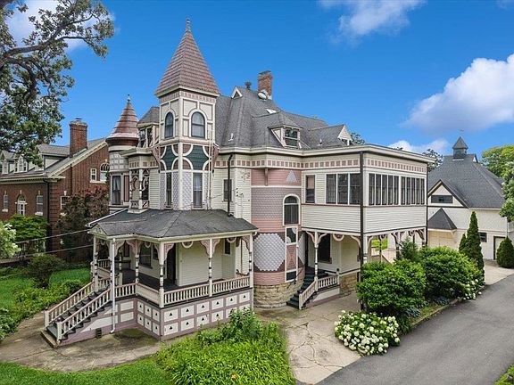 Beautiful woodwork! Incredible porch! 8-bedroom historic estate in Illinois. $550,000.