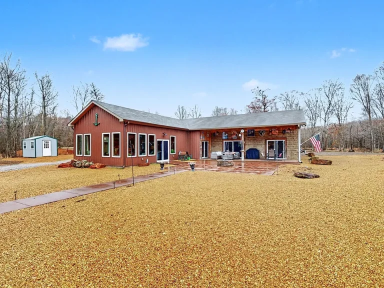 Check out the sunroom and ponds! Custom home on 14 acres in Tennessee. $925,000.