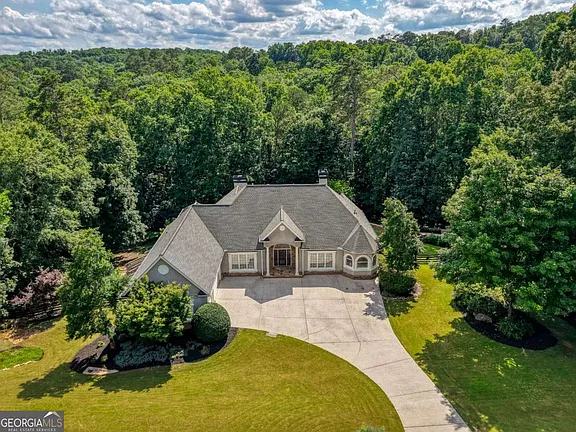 Glass solarium and saltwater pool! Custom estate on 3.76 acres in Georgia. $1,200,000.